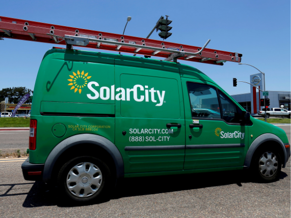 Musk arrives at trial to defend Tesla's $2.6 billion deal for SolarCity