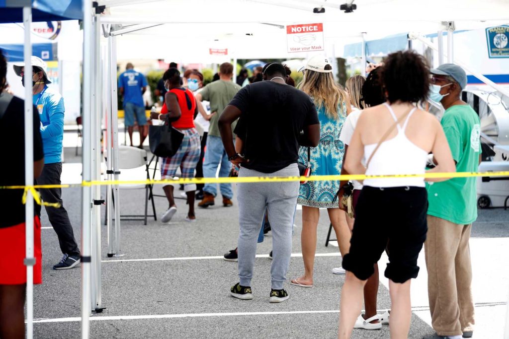 Patients wait in line to get a swab test at a COVID-19 mobile testing site hosted by the Manatee County Florida Department of Health in Palmetto, Florida, U.S., August 2, 2021. REUTERS/Octavio Jones
