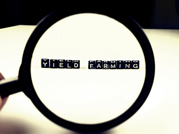 What is the difference between yield farming and staking?