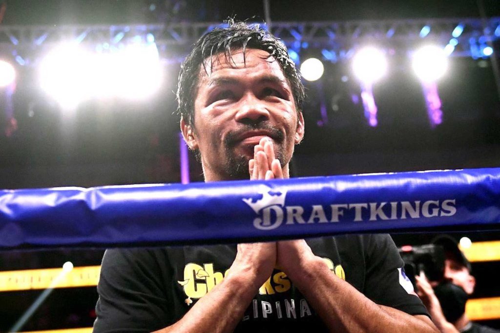 Manny Pacquiao of the Philippines waves and bows at the crowd after losing against Yordenis Ugas of Cuba following the WBA Welterweight Championship boxing match at T-Mobile Arena in Las Vegas, Nevada on August 21, 2021. AFP