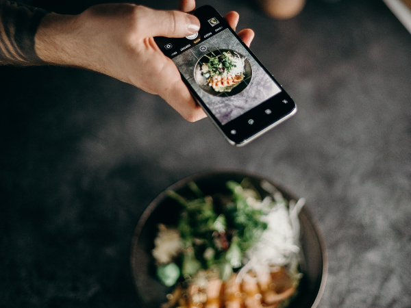 This is a person taking a photo of food.