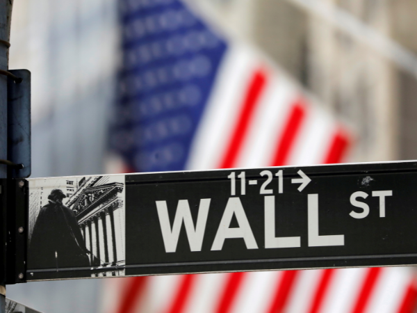Wall Street closes almost flat on cautious note ahead of Fed