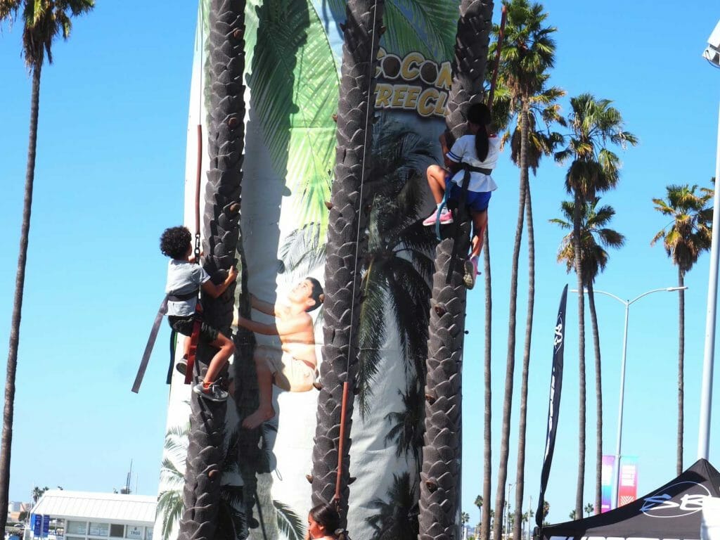 Kids in safety harness climbing fake coconut trees at A Taste of the Philippines festival in San Diego, California. INQUIRER/Florante Ibanez