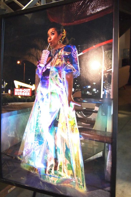 Visual artist Jaana “Jaja” Barker welcomed  attendees by modeling photographs of a gown she made from PVC holographic materials. CONTRIBUTED