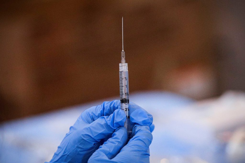 A syringe is filled with a dose of Pfizer's COVID-19 vaccine at a pop-up community vaccination center at the Gateway World Christian Center in Valley Stream, New York, U.S., February 23, 2021. REUTERS/Brendan McDermid/File Photo