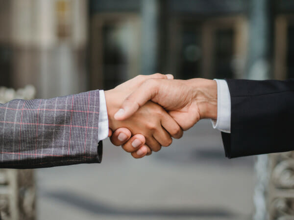 It is a financial advisor shaking hands with a client.