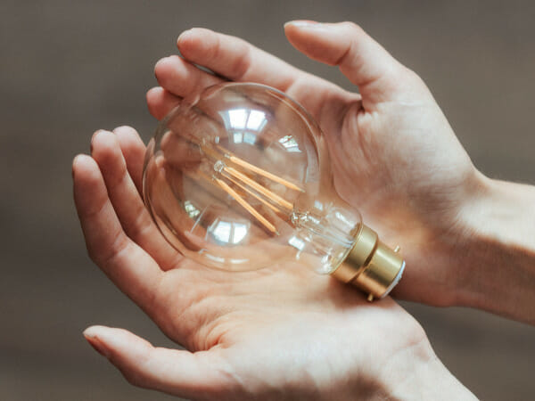 It's a light bulb in someone's hands.
