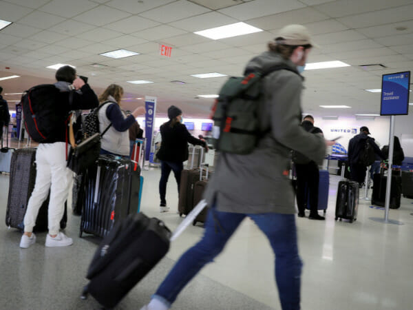 Excited travelers line up for US flights as COVID travel bans are lifted