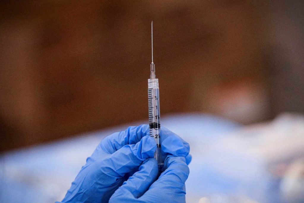 A syringe is filled with a dose of Pfizer's COVID-19 vaccine at a pop-up community vaccination center at the Gateway World Christian Center in Valley Stream, New York, U.S., February 23, 2021. REUTERS/Brendan McDermid