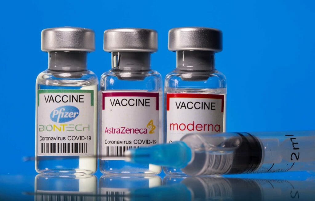 Vials with Pfizer-BioNTech, AstraZeneca, and Moderna coronavirus disease (COVID-19) vaccine labels are seen in this illustration picture taken March 19, 2021. REUTERS/Dado Ruvic/Illustration