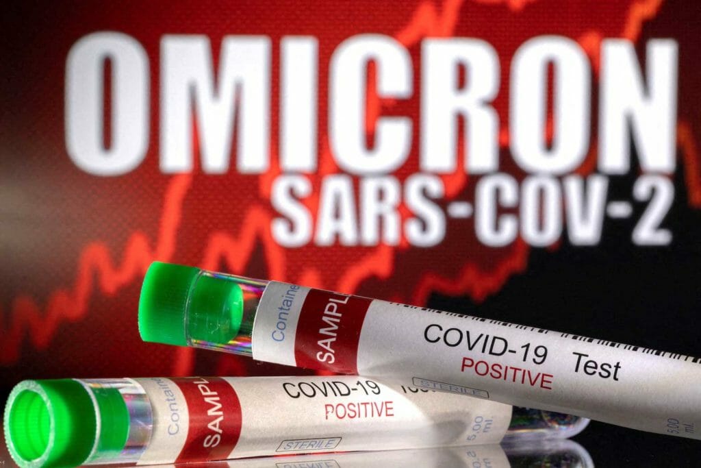  Test tubes labeled "COVID-19 Test Positive" are seen in front of displayed words "OMICRON SARS-COV-2" in this illustration taken December 11, 2021. REUTERS/Dado Ruvic/Illustration