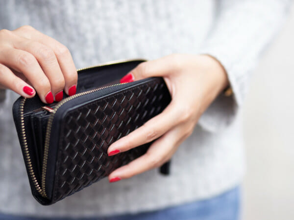 This is a person reaching into a wallet.