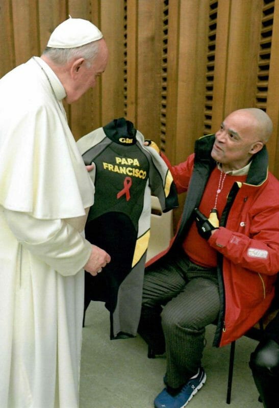 Don Victor Mooney presents Pope Francis with a wetsuit at the Vatican on World AIDS Day (December 1, 2021). CONTRIBUTED