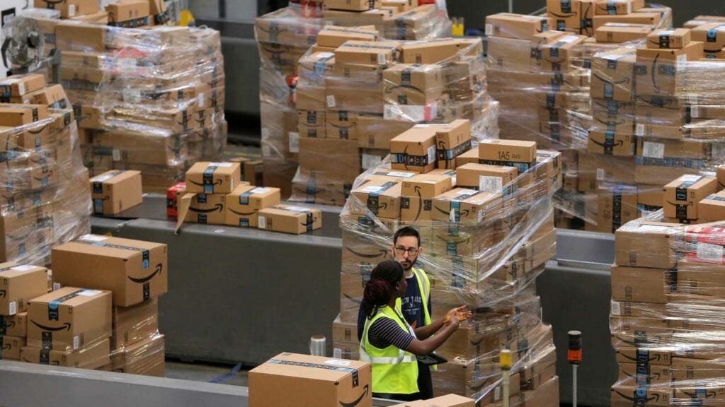  Amazon workers among boxes at a warehouse (Reuters / Lucas Jackson)