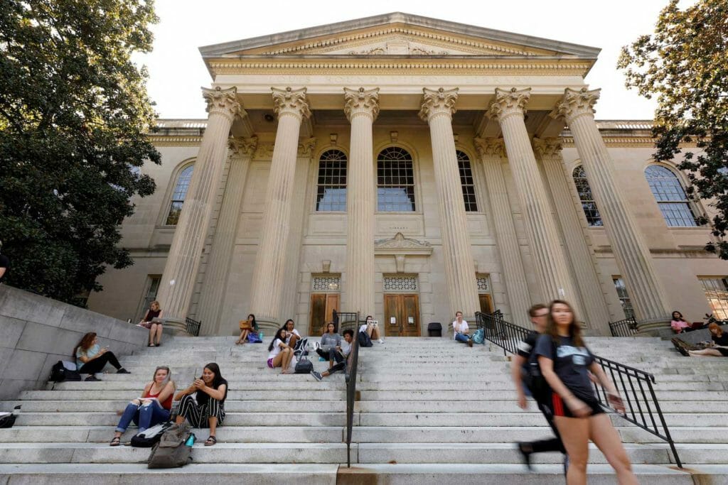 Students sit on the steps of Wilson Library on the campus of University of North Carolina at Chapel Hill, North Carolina, U.S., September 20, 2018. REUTERS/Jonathan Drake/File Photo