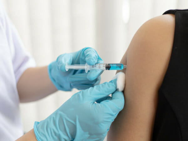 This is a person getting a COVID vaccine.