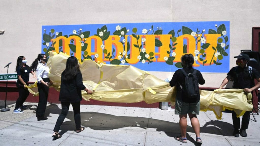 Photo from ourlittlemanila.nyc shows Unveiling the new mural in Woodside’s Little Manila neighborhood in 2020. (Little Manila Queens Bayanihan Arts)