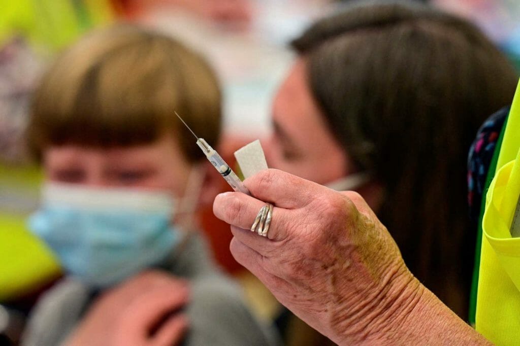 A child is seen near a syringe containing a dose of the Pfizer-BioNTech coronavirus disease (COVID-19) vaccine at Smoketown Family Wellness Center in Louisville, Kentucky, U.S., November 8, 2021. REUTERS/Jon Cherry