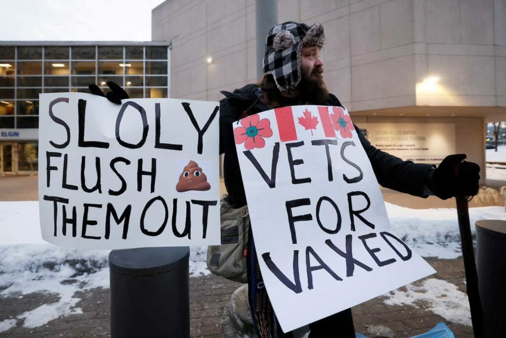 Clayton Goodwin, a military veteran and member of the Veterans Accountability Commission, demonstrates outside Ottawa Police Service headquarters as truckers and supporters continue to protest against the coronavirus disease (COVID-19) vaccine mandates, in Ottawa, Ontario, Canada, February 8, 2022. REUTERS/Blair Gable