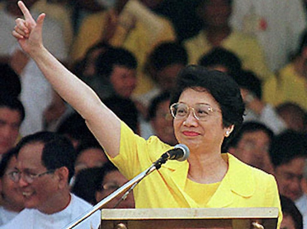 Victorious President Corazon Aquino during the People Power uprising that toppled the Marcos dictatorship. FILE PHOTO