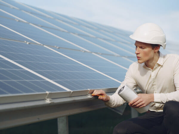 This is a person checking a solar panel.