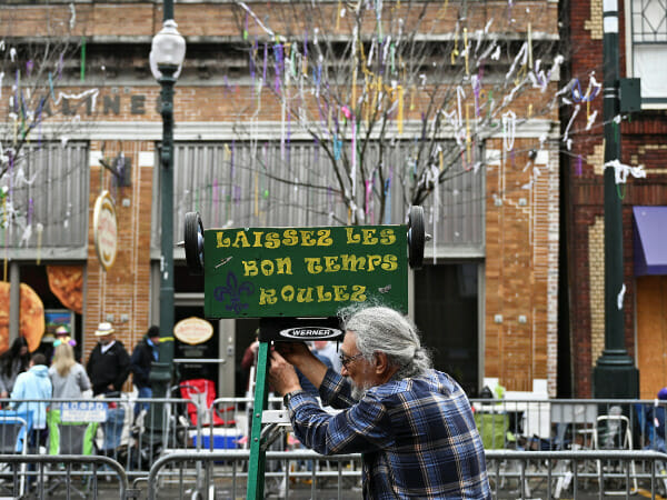 Emerging from a darkness: Mardi Gras attendees drop pandemic woes