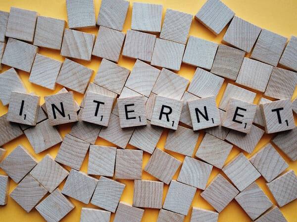 These are scrabble tiles that spell out the word, "INTERNET."