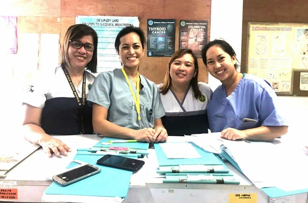 Trina (second from left) and Nicole (right) volunteering with two nurses at the JR Borja General Hospital in the Philippines in 2019. (Penn Medicine News)