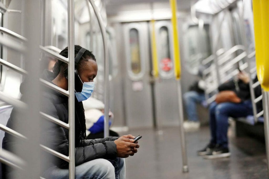A commuter wears a mask while riding the New York City Subway as the outbreak of the coronavirus disease (COVID-19) continues in the Manhattan borough of New York, U.S., April 30, 2020. REUTERS/Lucas Jackson