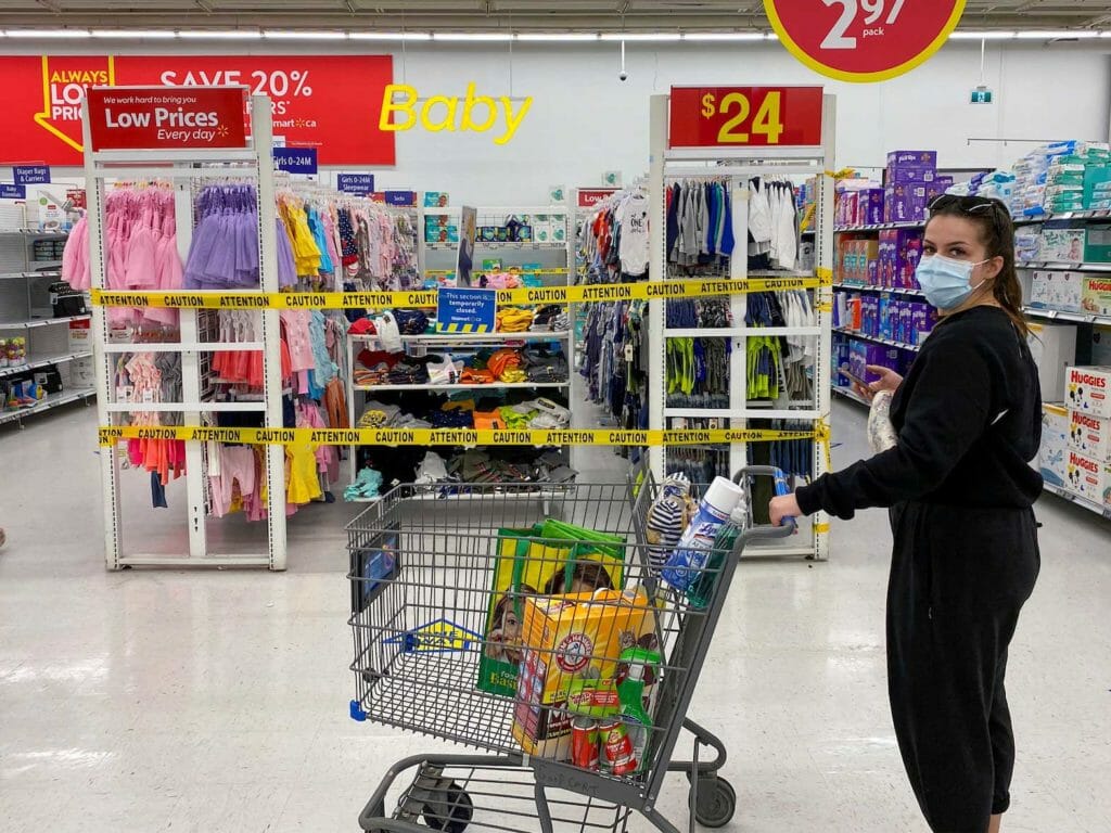 A woman looks on as she walks past at a Walmart store in Toronto, Ontario, Canada April 8, 2021. REUTERS/Carlos Osorio/File Photo
