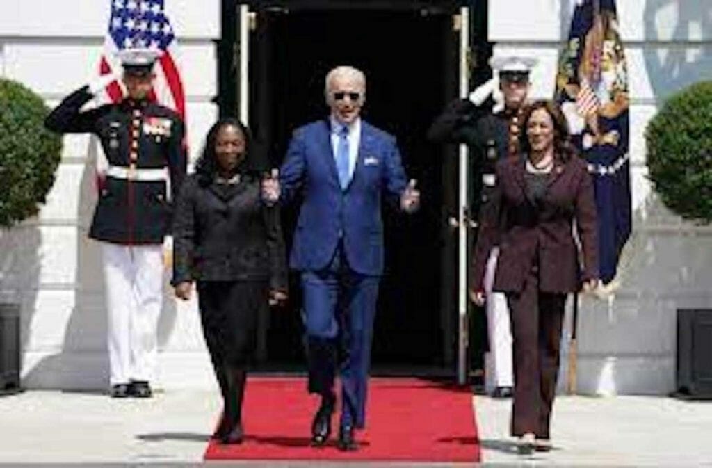 U.S. President Joe Biden walks out of the South Portico of the White House with Judge Ketanji Brown Jackson and Vice President Kamala Harris as they arrive for a celebration of Judge Jackson’s confirmation as the first Black woman to serve on the U.S. Supreme Court, on the South Lawn at the White House in Washington, U.S., April 8, 2022. REUTERS/Kevin Lamarque