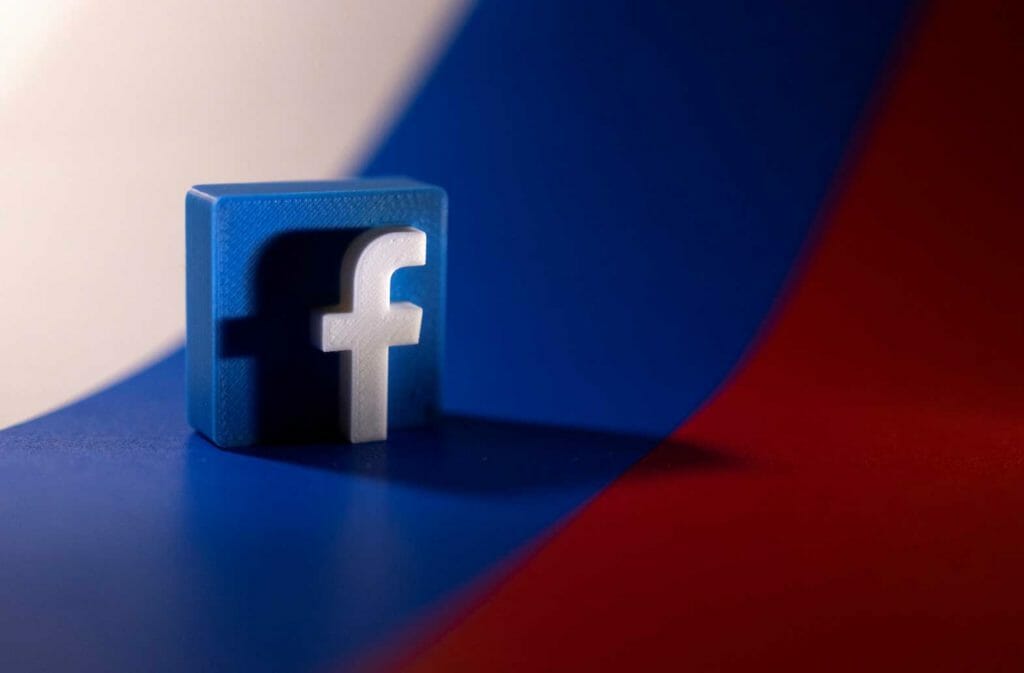 Facebook logo is placed on a Russian flag in this illustration picture taken February 26, 2022. REUTERS/Dado Ruvic/Illustration