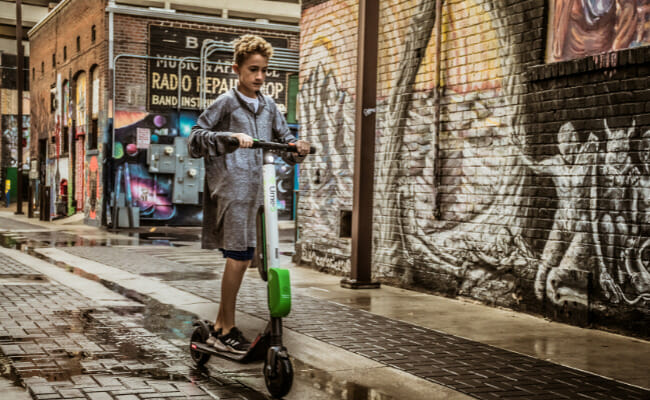 This is a person riding one of the best electric scooters.