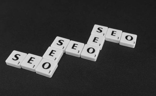 These are scrabble tiles that spell out "SEO" multiple times.