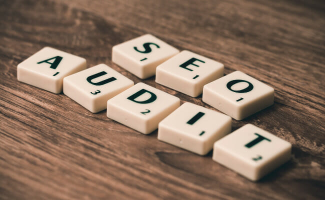 These are scrabble tiles that spell out, "SEO AUDIT."