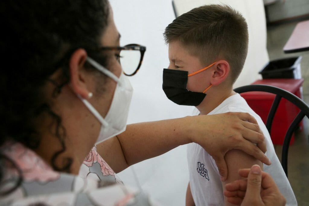 A child is administered a dose of the Pfizer-BioNTech coronavirus disease (COVID-19) pediatric vaccine, in San Jose, Costa Rica February 23, 2022. REUTERS/Mayela Lopez