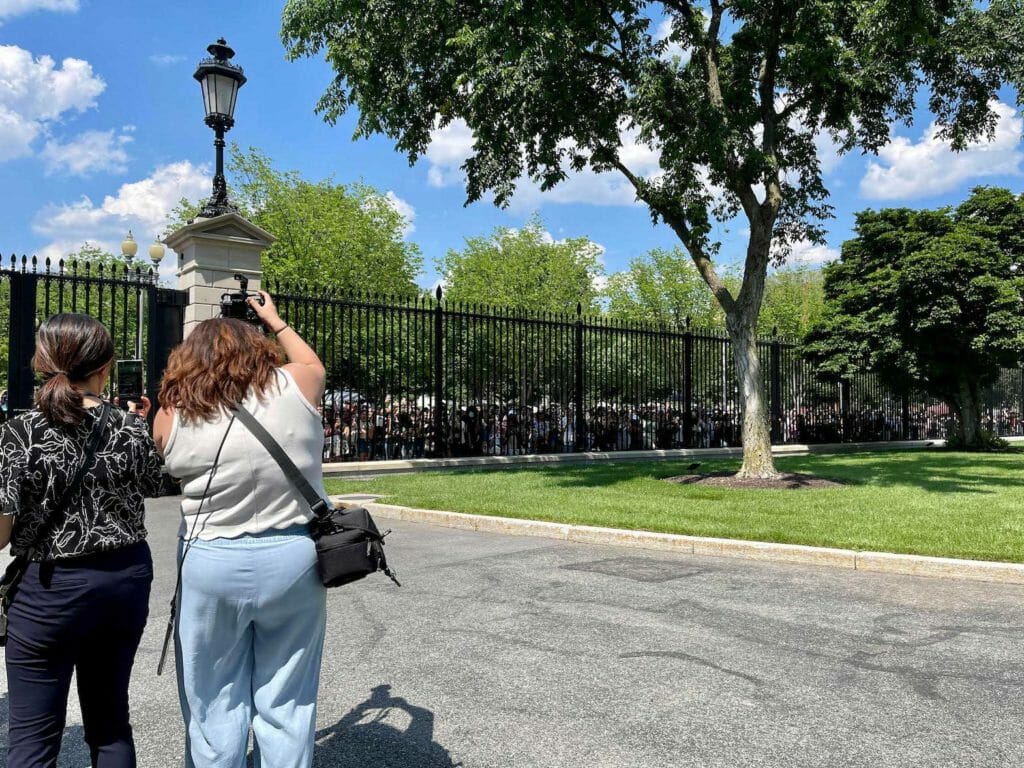 Press photographers shoot a horde of BTS ARMY fans outside the White House gate hoping to catch a glimpse of their fav K-pop band. INQUIRER/Elton Lugay