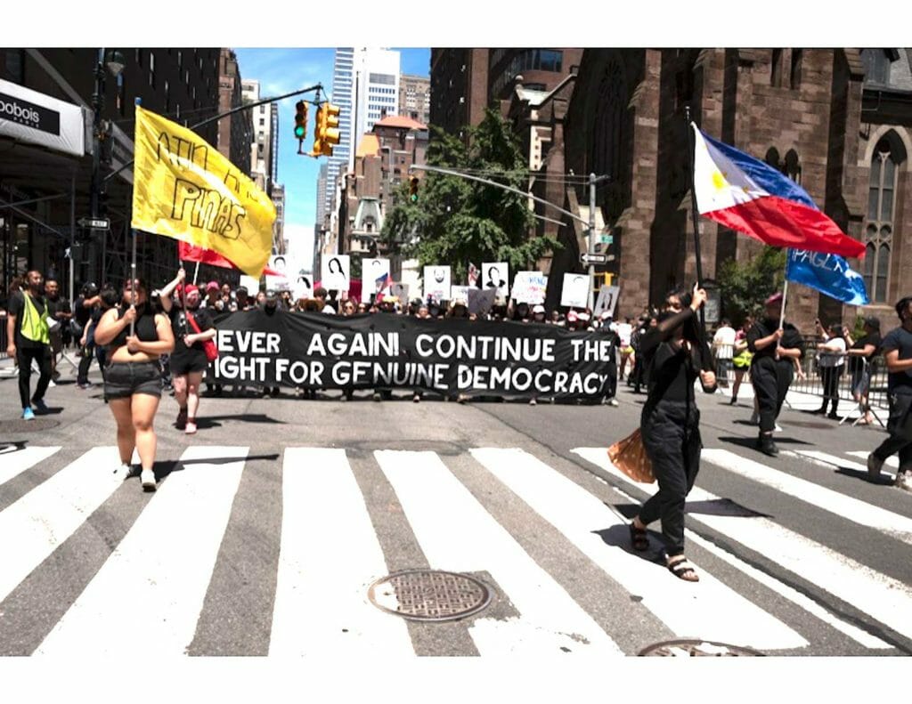 The NEVER AGAIN contingent was the last to join the procession towards Madison Square Park, an attempt by the organizers to downplay the protest the marchers were only too willing to voice. (Photo: Zack Garlitos)