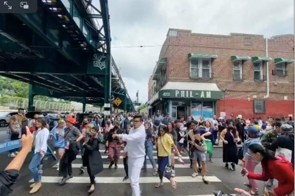 Spontaneous line dancing at the official ceremony naming a neighborhood in Woodside, Queens, New York "Little Manila." SCREENGRAB