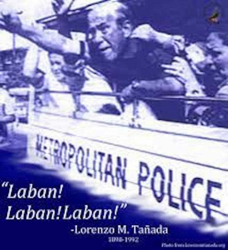 Senator Lorenzo Tañada in a defiant pose, raises a clenched fist from inside a police van. INQUIRER FILE