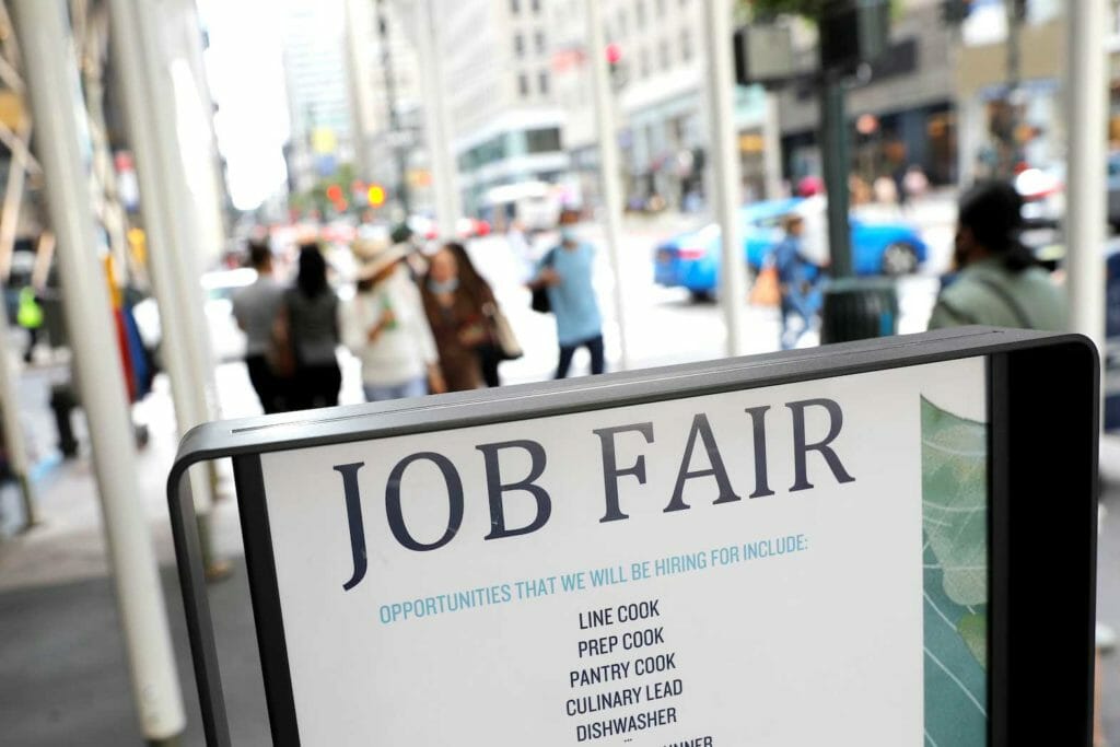  Signage for a job fair is seen on 5th Avenue after the release of the jobs report in Manhattan, New York City, U.S., September 3, 2021. REUTERS/Andrew Kelly