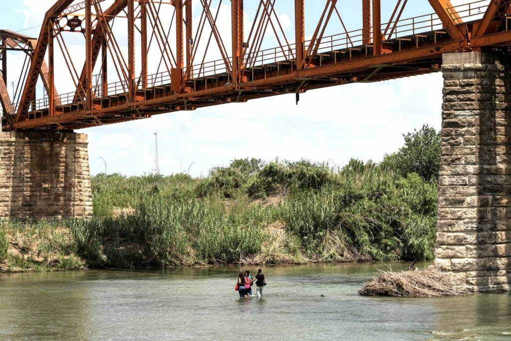 Asylum seeking migrants cross the Rio Grande river into the U.S. from Mexico at Piedras Negras, Mexico, July 13, 2022. REUTERS/Go Nakamura