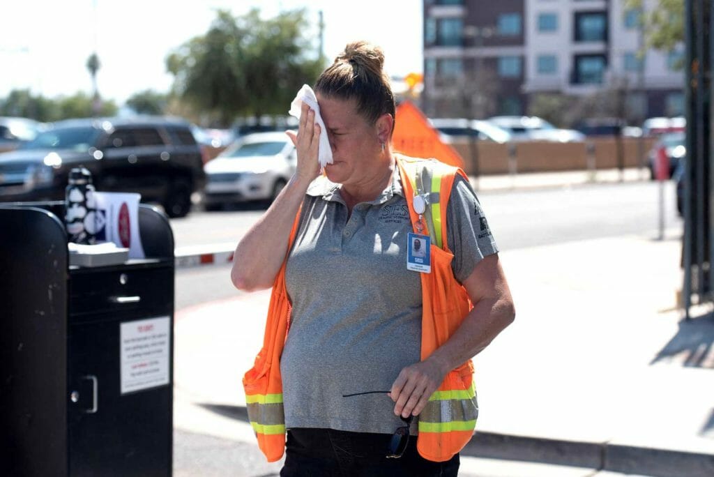 Woman trying to endure 106-degree heat in Phoenix, Arizona. REUTERS