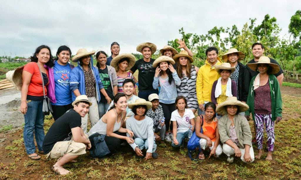 A batch of FYLPRO young leaders, on immersion in the Philippines, seen here with rural residents. WEBSITE