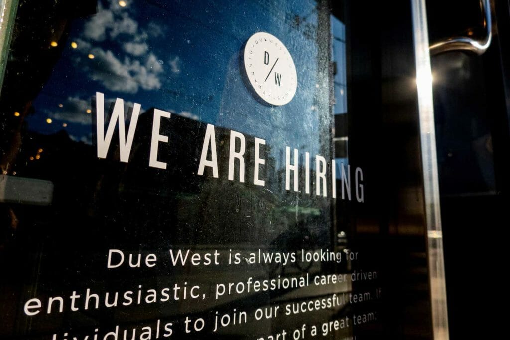 A help wanted sign at a store along Queen Street West in Toronto Ontario, Canada June 10, 2022. REUTERS/Carlos Osorio