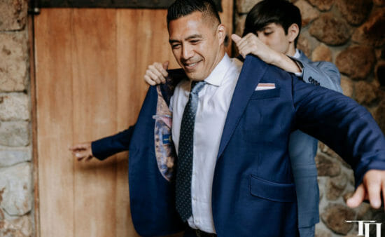 Best man helping groom avoid fashion mistakes