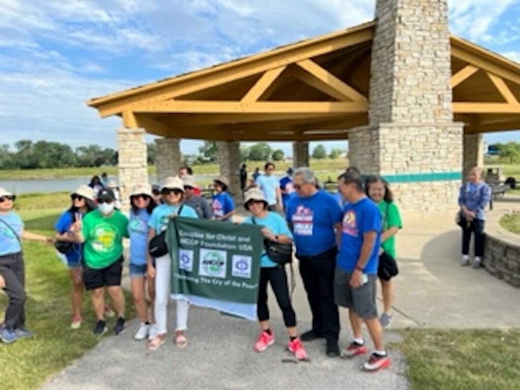 Answering the Cry of the Poor (ANCOP) Walk on Aug. 13, was founded by COUPLES for Christ. In photo is Danny Dizon, (third from right) ANCOP Illinois Chapter head and Mia Pacheco (fifth from right), ANCOP Regional Manager. A picnic was held afterward by the Couples for Christ. CONTRIBUTED