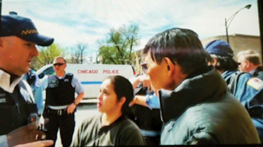 APRIL 2017 PROTEST vs. LEHMAN: Self-appointed FACGC executive director Elaine Lehman asks Chicago police officers to remove original board directors from the Jose Rizal Heritage Center after they fired her from her position. Her enablers like Dr. Rufino Crisostomo (R) she was able to illegally retain her title and make the Rizal Center her residence for five years. Circuit Judge Quish in her verdict order her to vacate the place and stop representing the FACGC. (PINOY file photo / Anong)