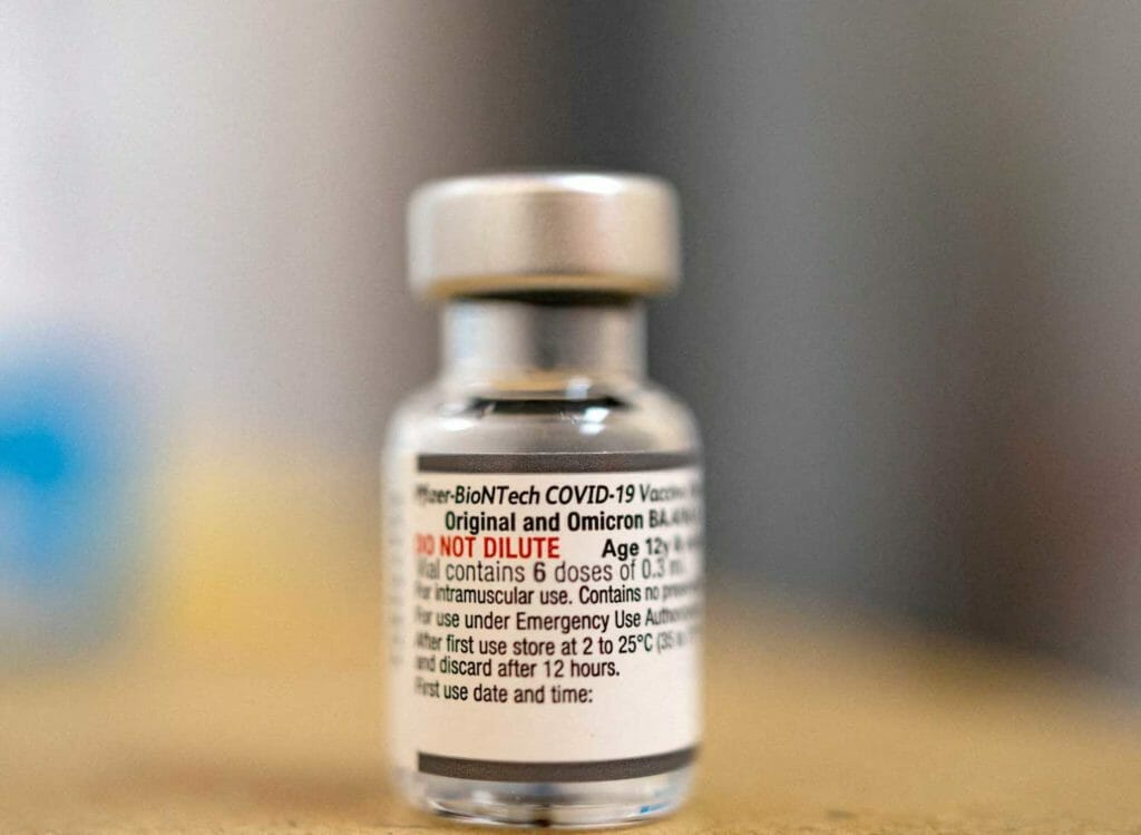 A vial of the Pfizer-BioNTech coronavirus disease (COVID-19) booster vaccine targeting BA.4 and BA.5 Omicron sub variants is pictured at Skippack Pharmacy in Schwenksville, Pennsylvania, U.S., September 8, 2022. REUTERS/Hannah Beier/File Photo