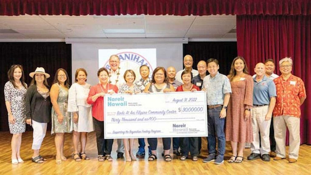 Nareit Hawaii Executive Director Gladys Quinto Marrone (middle left) presented Binhi At Ani President Melen Agcolicol (middle right) with a grant of $30,000 to support its program providing free meals to Maui seniors on fixed incomes. CONTRIBUTED